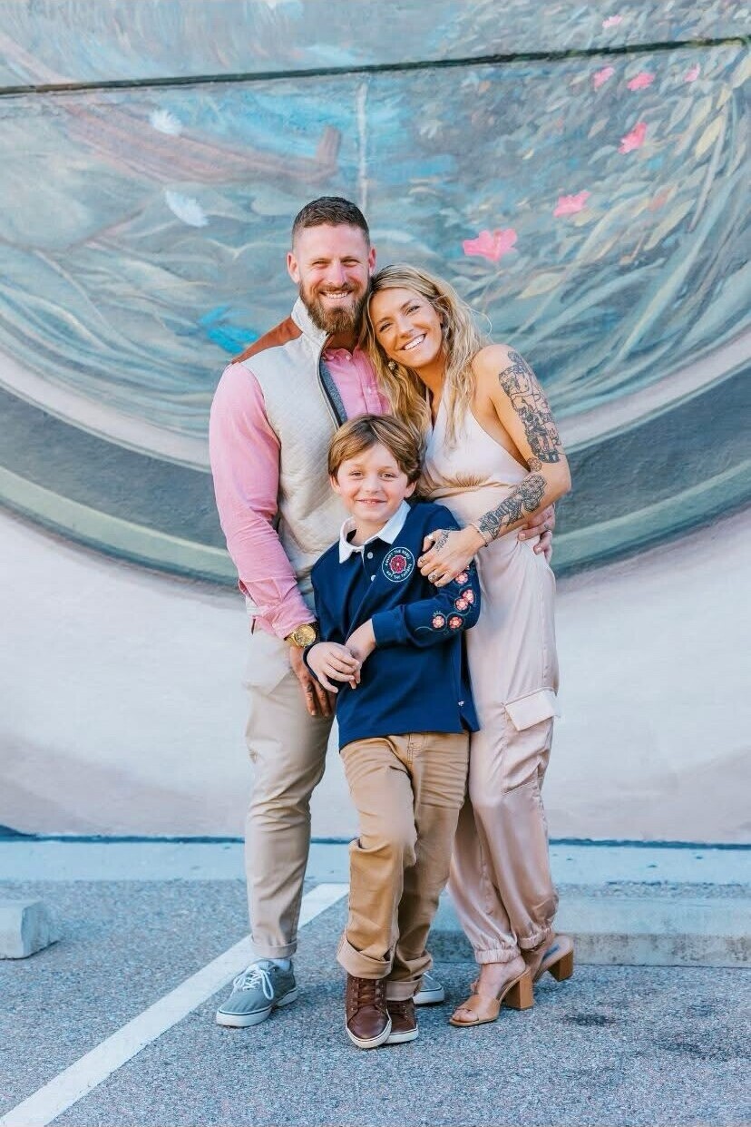 Brennan Pope with his wife and son