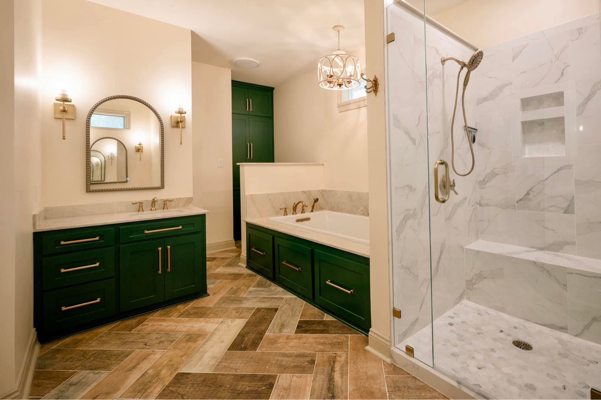 Green vanity bathroom with herringbone floor