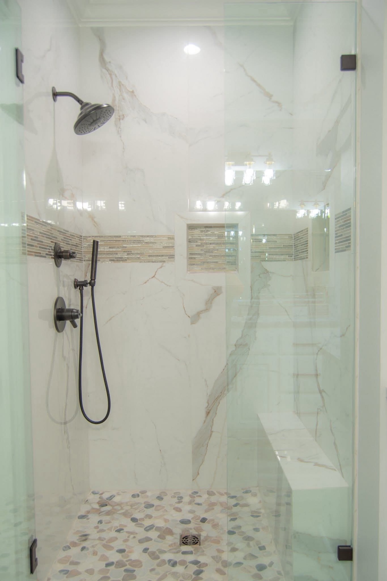 Marble walk-in with pebble floor