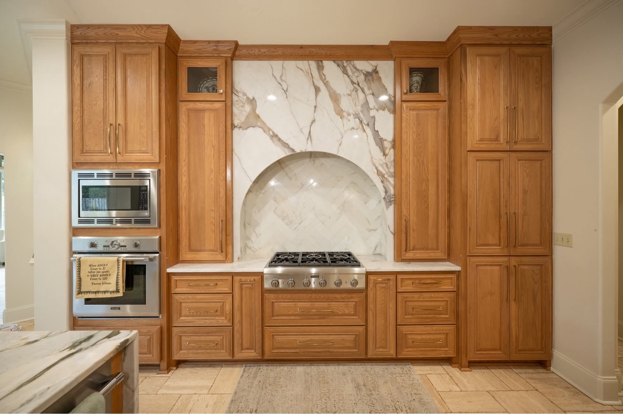 Wood pantry with marble countertop