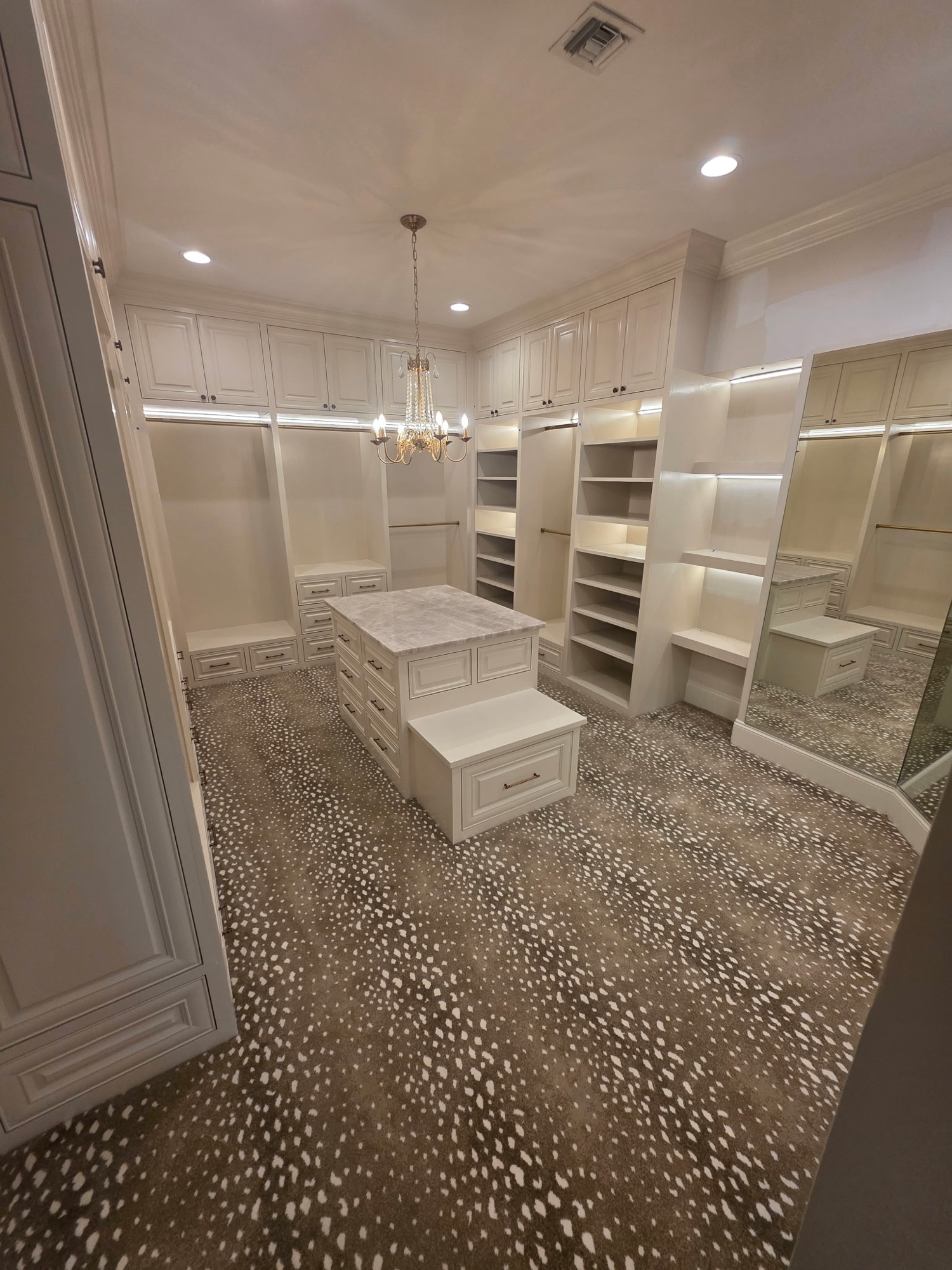 Walk-in closet with pendant lighting