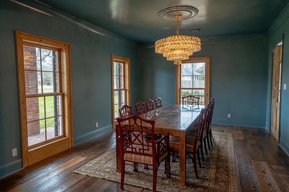 Blue dining room with chandelier
