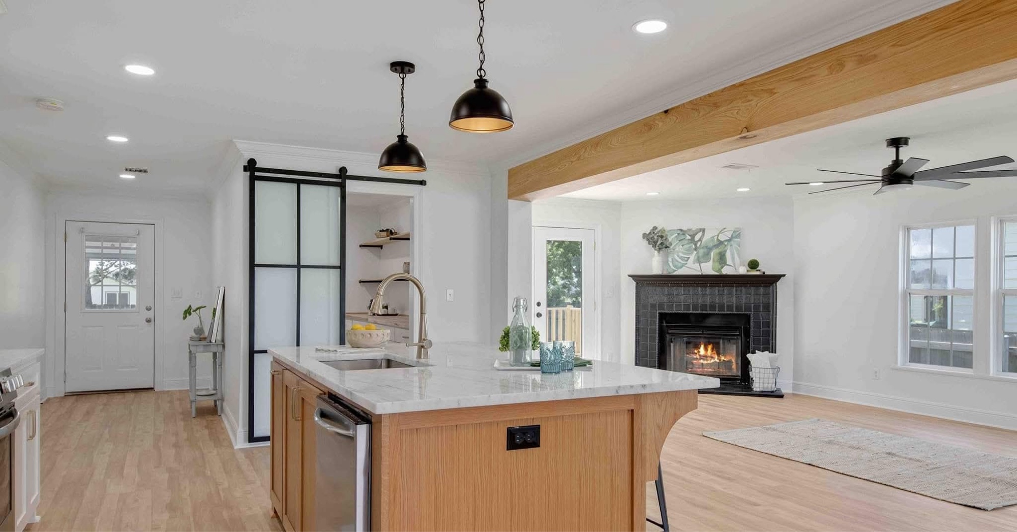 Kitchen with pendants and barn door